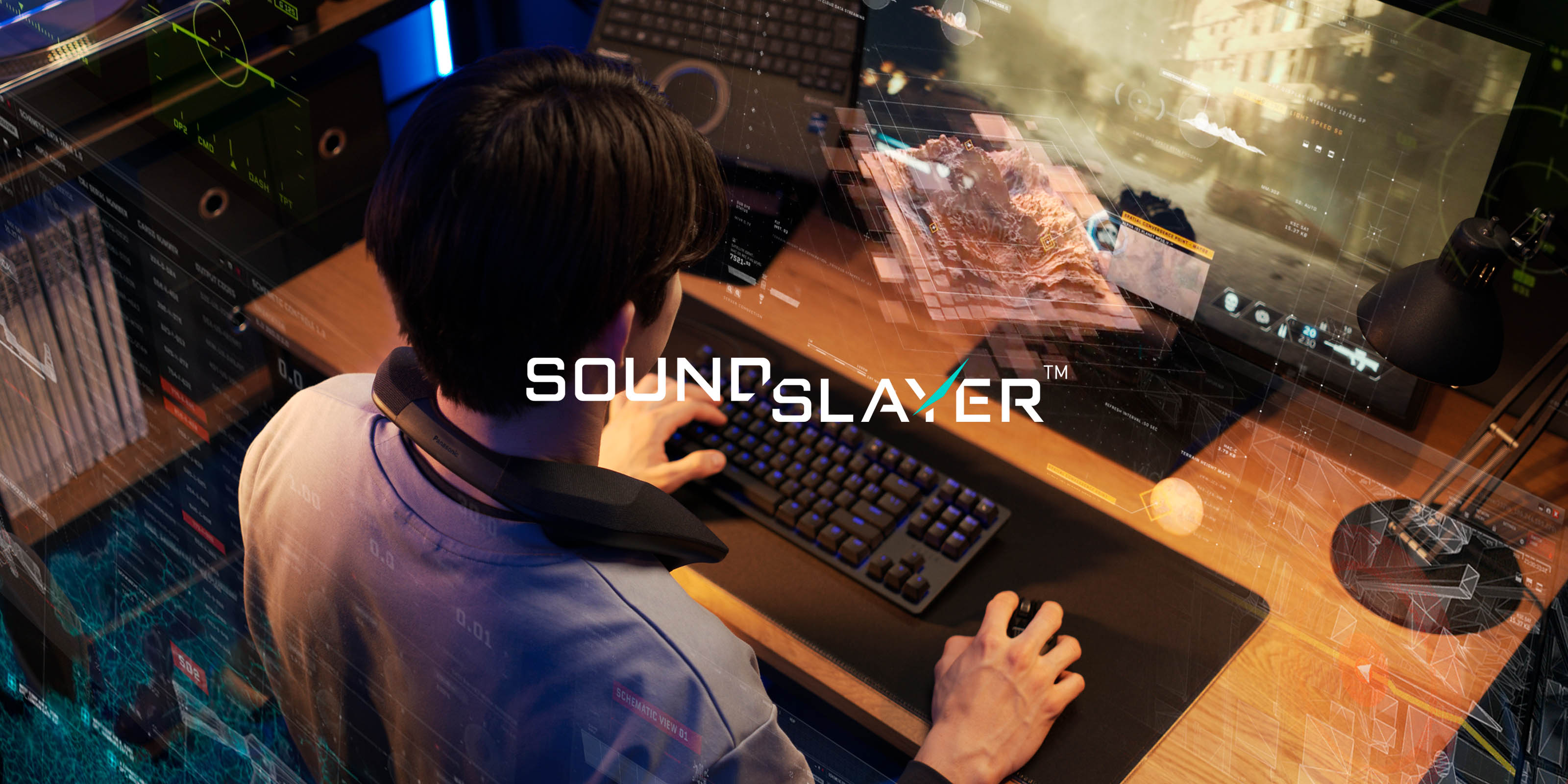 Person using a computer with gaming neck speaker and 'Soundslayer' branding in a home studio setting.