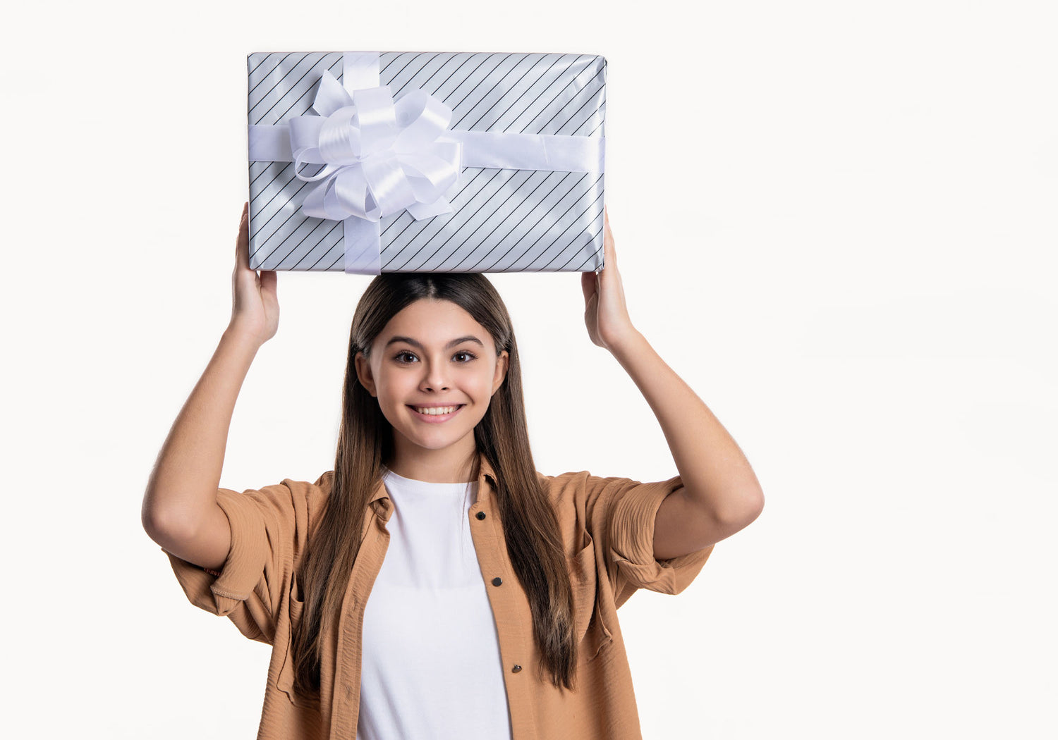 teenager holding a present above their head
