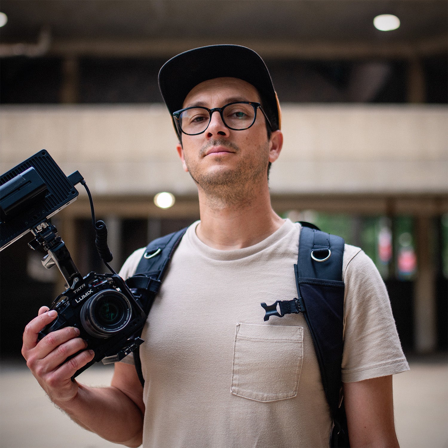 Photographer Kyle Camarillo holds a LUMIX camera in his hand