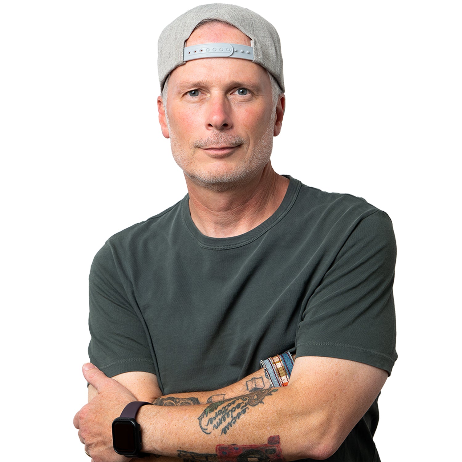 photographer todd white wears a backwards hat and crosses his arms while smiling at the camera