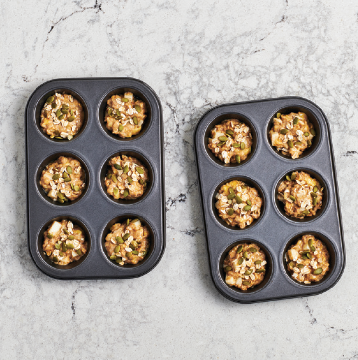 breakfast muffins uncooked in muffin tins